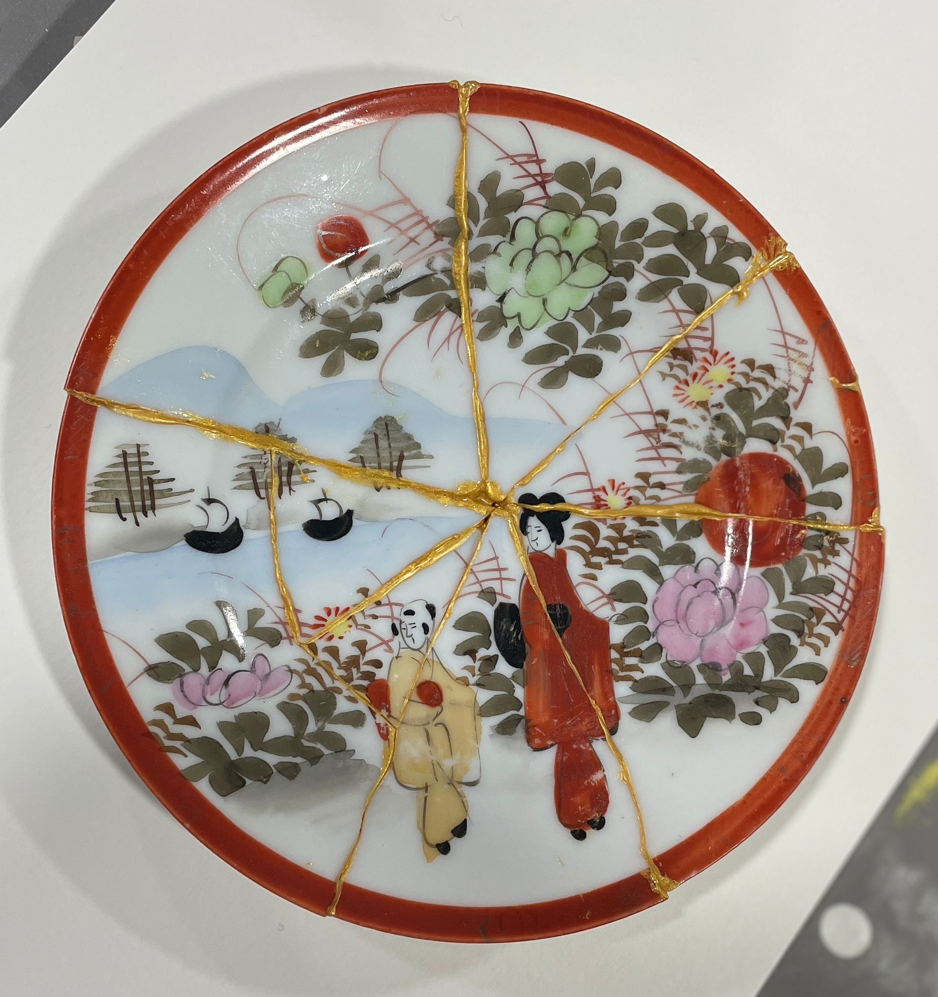 kintsugi plate made in a workshop held by The curator Educator